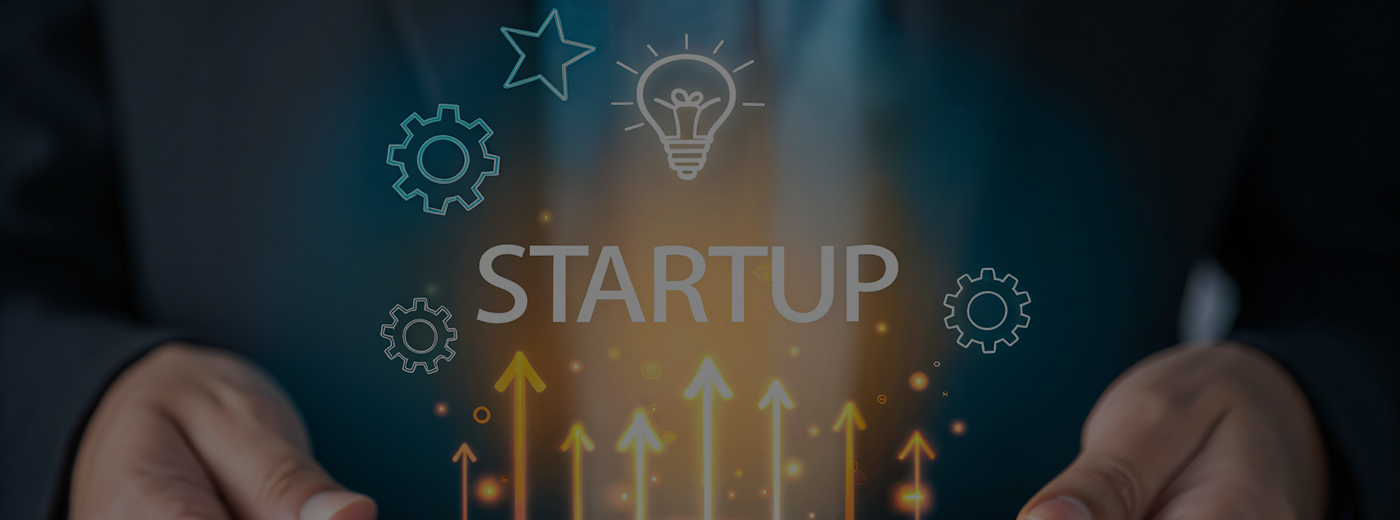Man holds an image that says Startup
