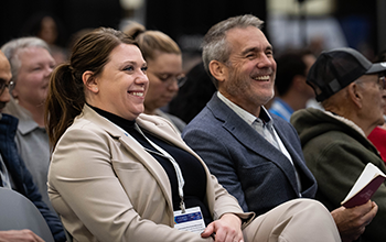 Attendees smile as the listen to a keynoter at MD&M Midwest