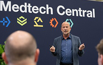 Attendees listen to the speaker on the Medtech Central stage