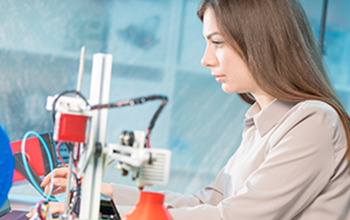 Professional female engineer working with 3d printing