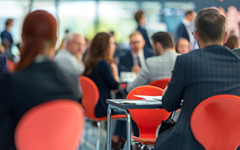 Business people engaging in a speed networking session